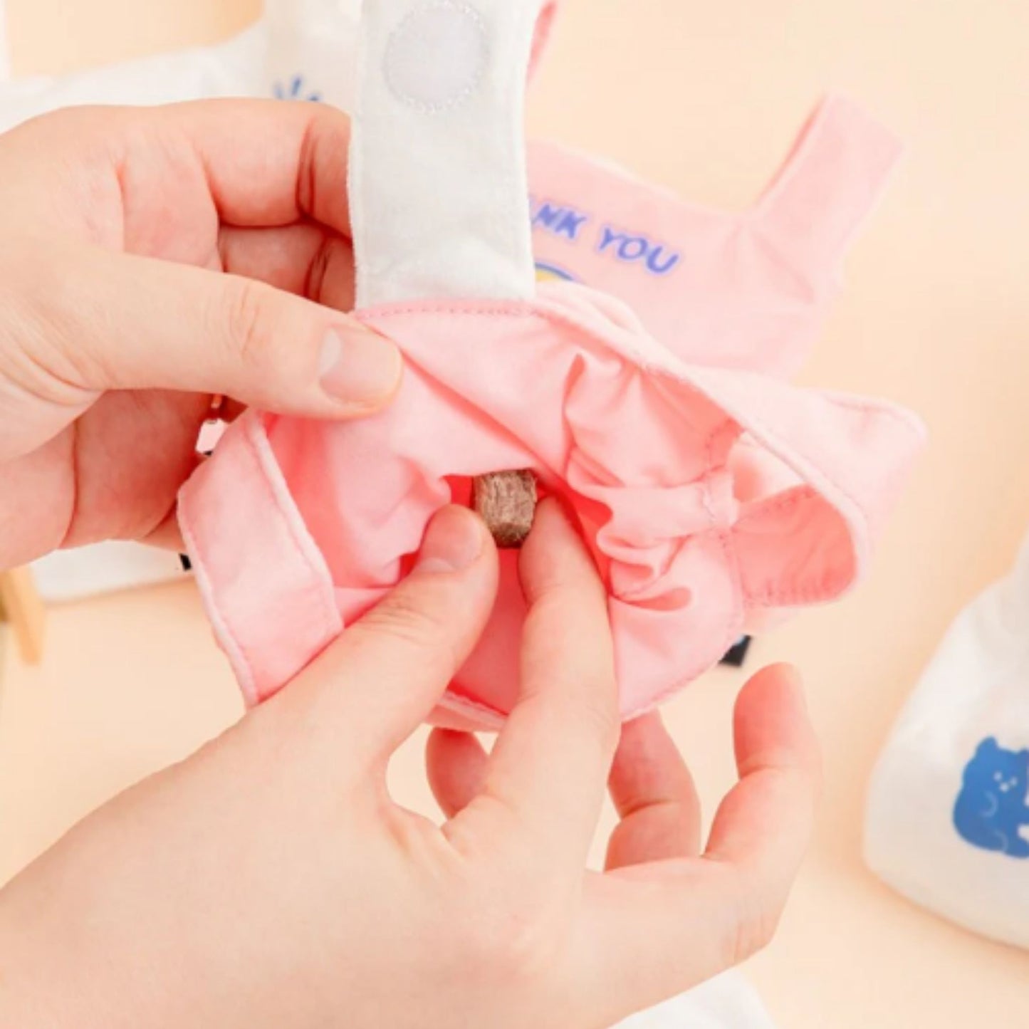 Close-up of the Pink BITE ME Crinkle Shopping Bag showing the soft plush material and opening.