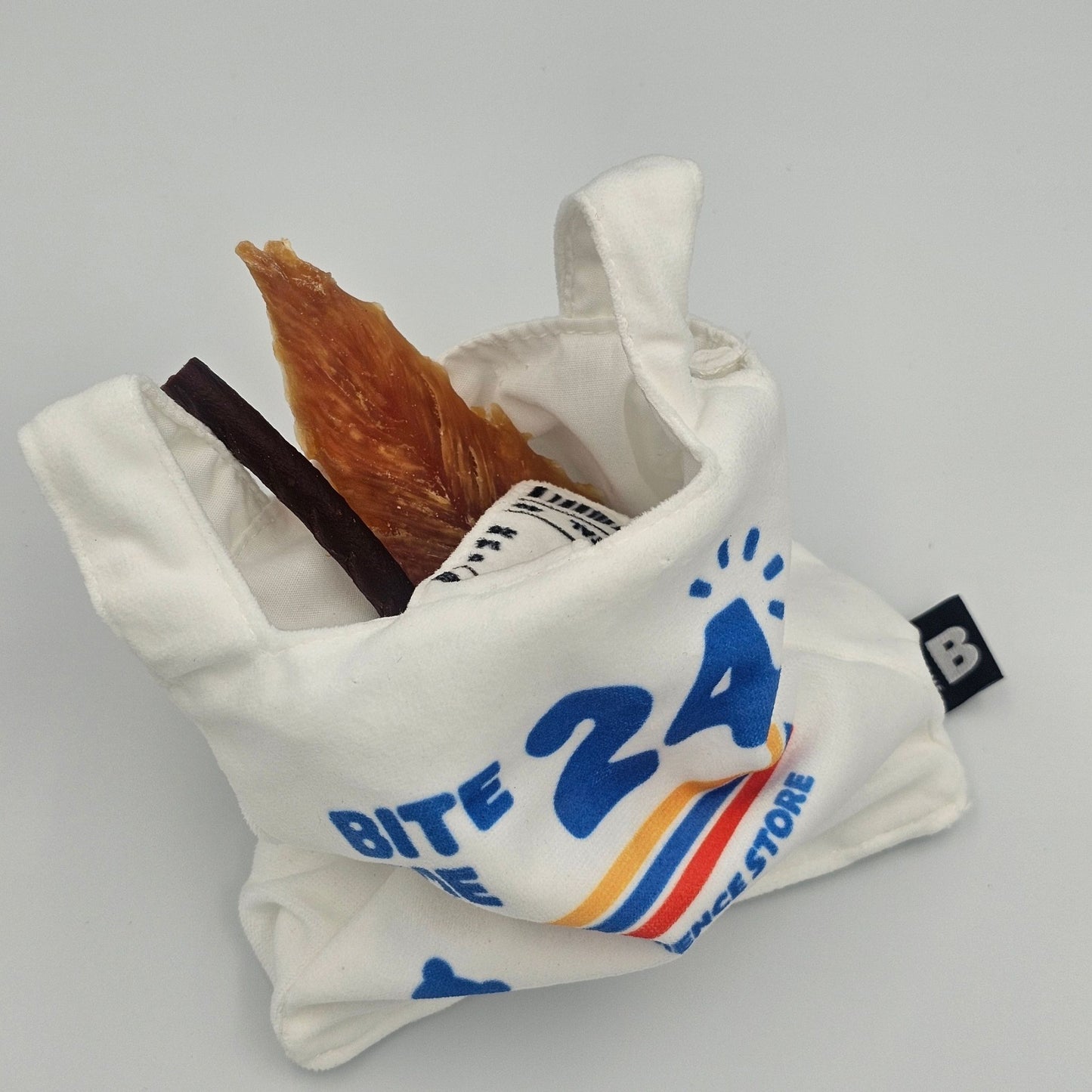 BITE ME Crinkle Bag Nosework Dog Toy filled with dog treats for nosework enrichment play