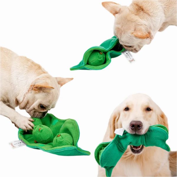 Dogs playing with the Squeaky Peas snuffle dog toy, a soft green pea pod plush with hidden squeaky peas inside