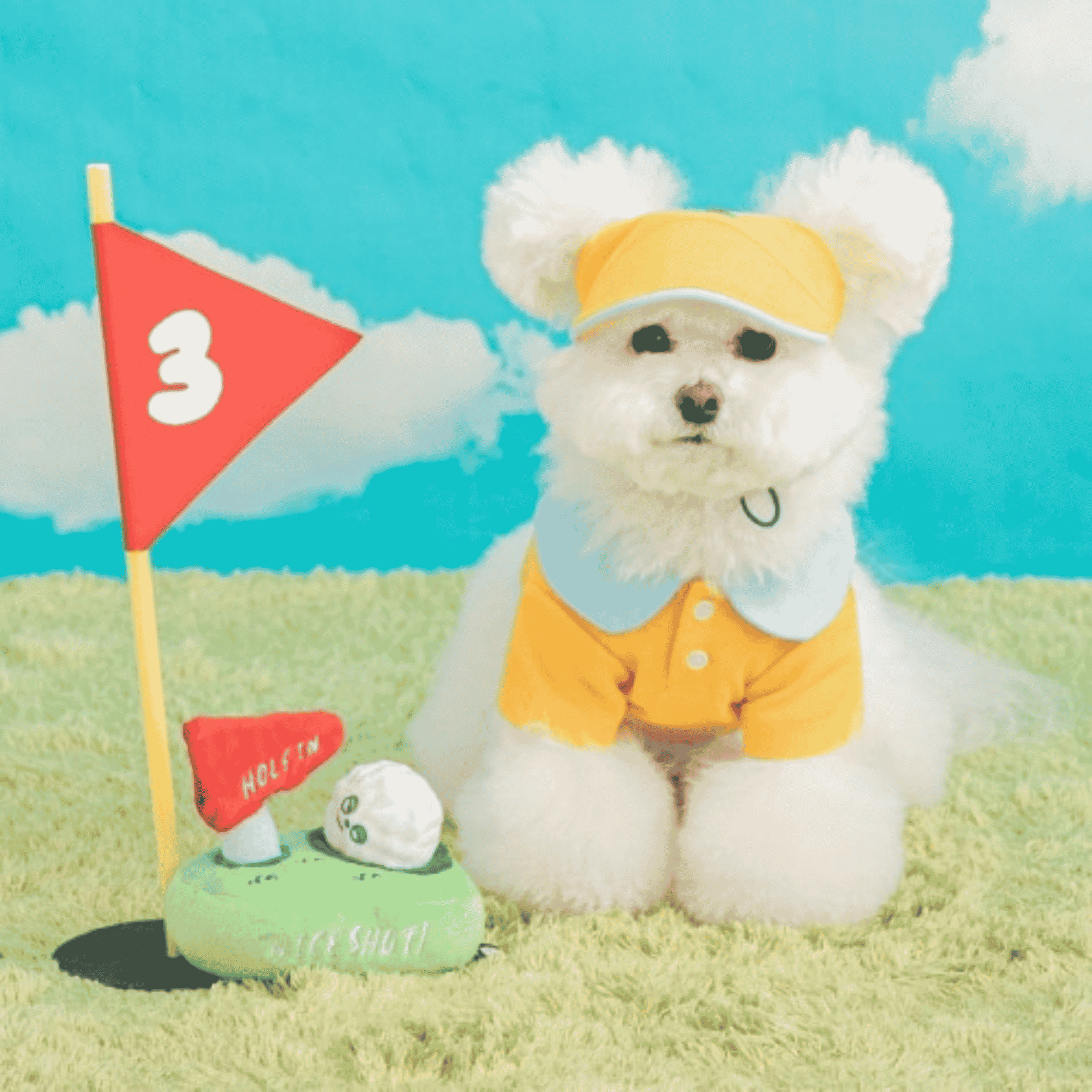Small dog sitting beside the BITE ME Golf Nosework Toy with golf ball and flag.