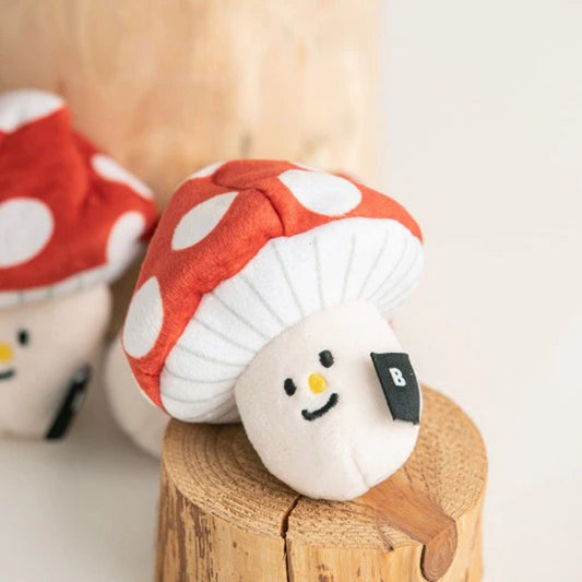 BITE ME Mushroom Nosework Toy displayed on a wooden stump, featuring a detachable mushroom cap for beginner nosework games.