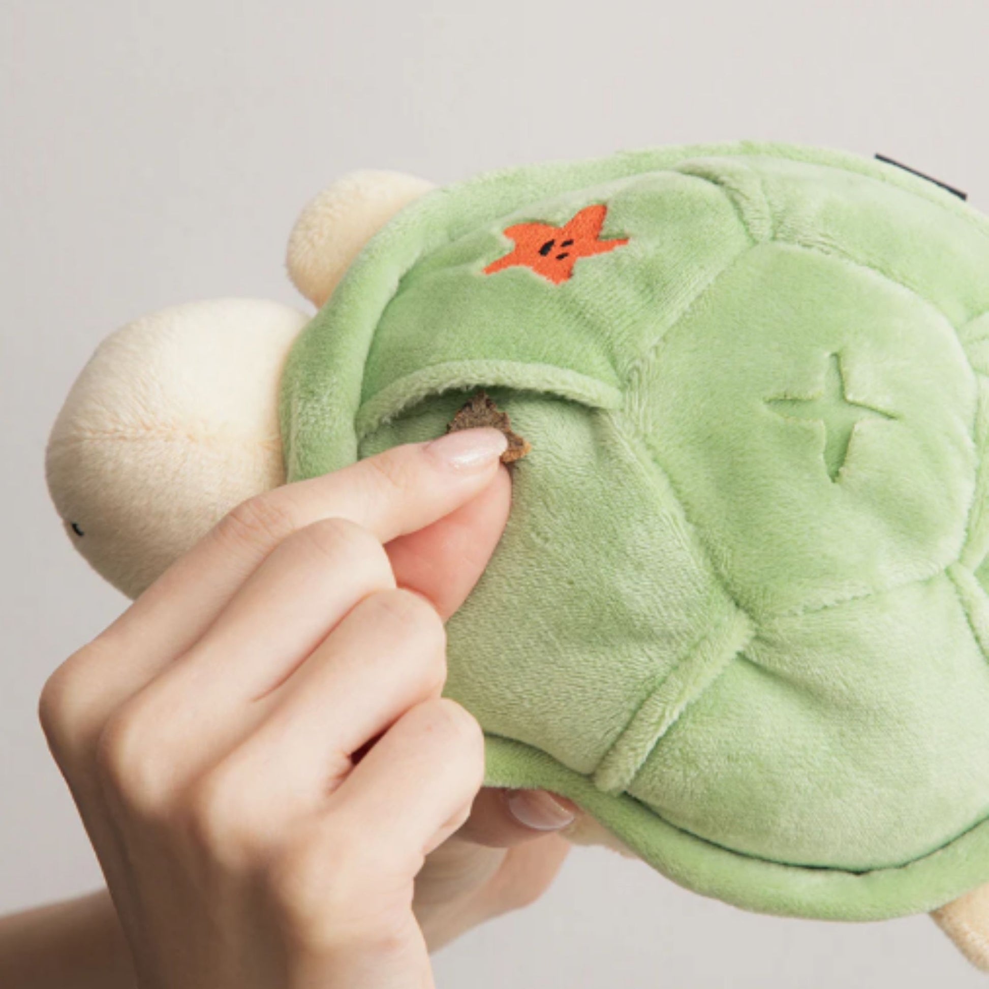 Close-up of the treat pocket on the BITE ME Jumping Boogie Auto-Ball Toy