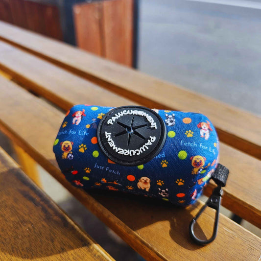 Pawcurement Fetch for Life Poop Bag Holder resting on wooden table showing carabiner clip and durable design
