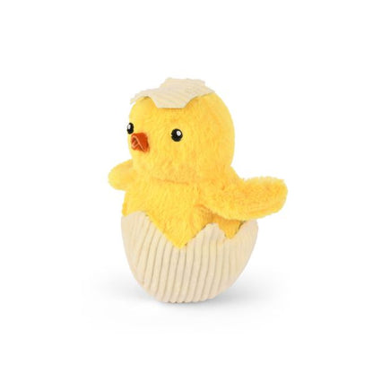 Angled view of the P.L.A.Y. Hippity Hoppity Chick Me Out plush dog toy with cracked eggshell design