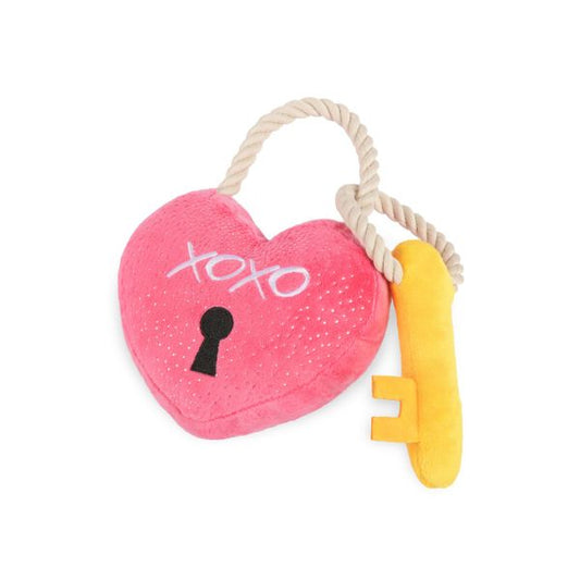 Angled view of the P.L.A.Y. Love Bug Love You a Lock Dog Toy with attached yellow key and textured heart design