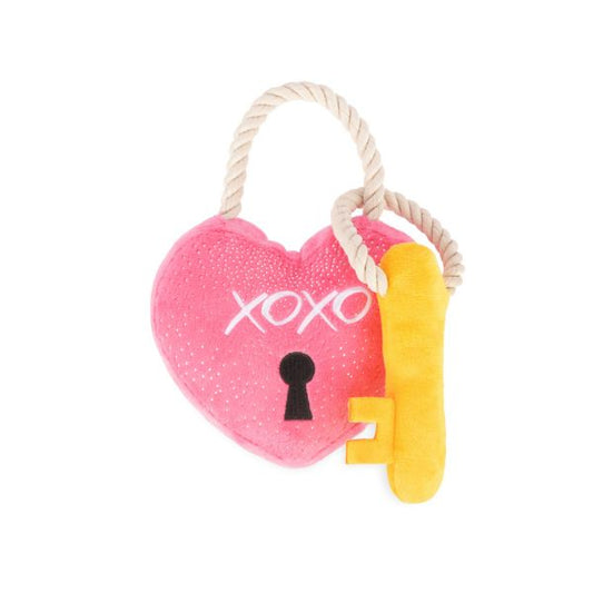 P.L.A.Y. Love Bug Love You a Lock Dog Toy featuring plush pink heart lock with keyhole and yellow key on rope