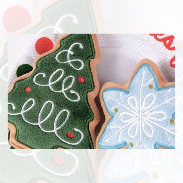 Close-up of the P.L.A.Y. Woofmas Collection Christmas Eve Cookies dog toy showing detailed festive cookie designs.
