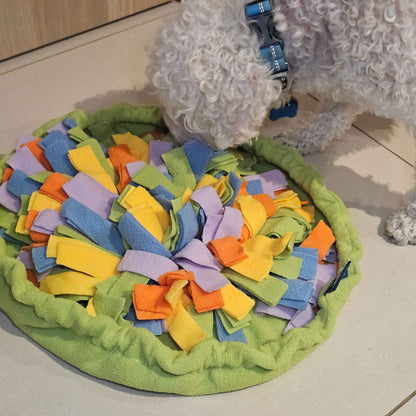 Dog sniffing and searching for treats in Sniff & Stash snuffle mat enrichment toy