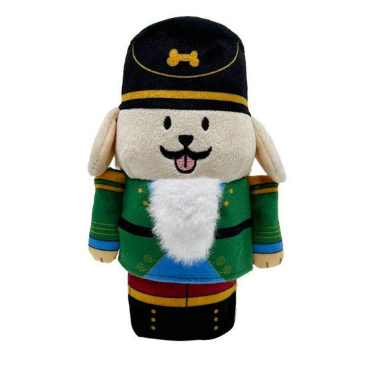 Front view of the Woof² Nutcracker Treat-Dispensing Dog Toy showing festive green uniform, plush details, and beard treat pocket.